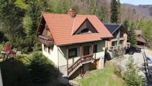 an aerial view of a house with an orange roof at Malinowy Domek w Szczyrku in Szczyrk