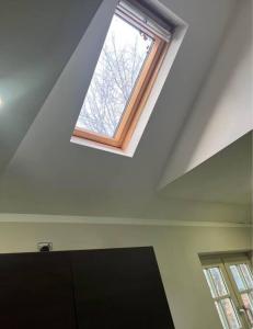 a skylight in a white room with a window at Unique Studio Flat in City Center in Leicester