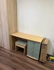 a desk with a drawer and a box next to it at Unique Studio Flat in City Center in Leicester