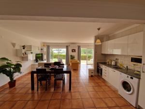 a kitchen and dining room with a table and chairs at Amazing Studio with Ocean View, Pool and Beach in Lagos