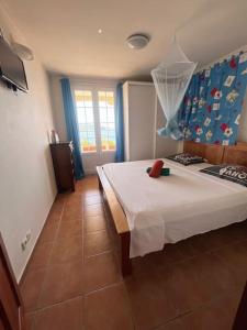 Postel nebo postele na pokoji v ubytování T2 Malendure avec vue Réserve Cousteau