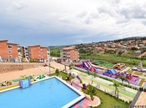 a water park with a pool and slides at ACACUS ROYALE in Kigali