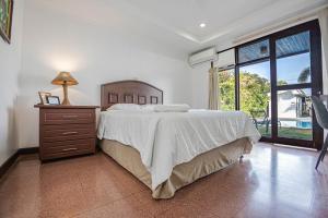 Postel nebo postele na pokoji v ubytování Hotel Caña Brava Inn
