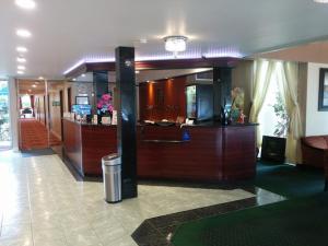 a lobby of a hotel with a bar in it at Hotel Pacific Garden in Gardena