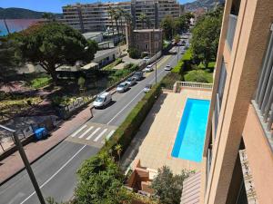 a view of a city street with a swimming pool at Mer et plage Standing Presta in Cannes