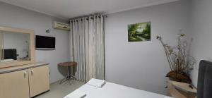 TV a/nebo společenská místnost v ubytování KOA Hotel Tiranë + 20 fotografií