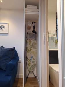 a door to a room with a surfboard in a closet at La'al Lodge in Kendal (The Gateway to the Lakes) in Kendal