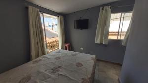a bedroom with a bed and a window at Hostel Jardim da Saúde in Sao Paulo +49 photos