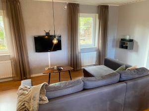 A seating area at Stockholm Archipelago House with shared pool