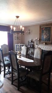 a dining room with a wooden table and chairs at No.9 in Tettenhall
