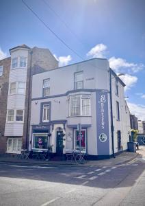 a large white building on the side of a street at Ebenezer's Place in Broadstairs