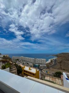 a view of the ocean from the balcony of a hotel at The Mayfair Village apto 305 in Patalavaca