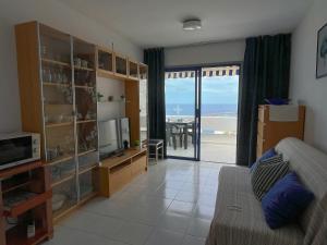 a living room with a view of the ocean at The Mayfair Village apto 305 in Patalavaca