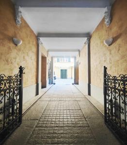 an empty hallway with two gates in a building at Ai Tetti Carignano in Turin