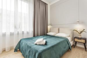 BlueBerry Apartment tesisinde bir odada yatak veya yataklar