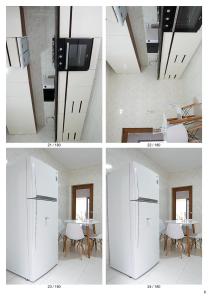Cette chambre comprend un réfrigérateur blanc et une table. dans l'établissement Moradia Triplex, à Praia