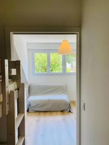 a bedroom with a bed and a window in a room at Joli studio au calme en bord de mer #pornichouette in Pornichet