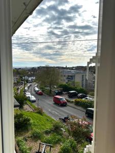 a view from a window of a street with cars at Deluxe Beach House in Brighton & Hove