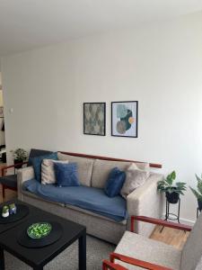 a living room with a couch and a table at Danube Sunrise in Kladovo +11 photos