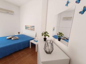 Posteľ alebo postele v izbe v ubytovaní Perla Home Speciale Vacanze 2025 Casa perfetta per gruppi coppie e famiglie vivi la Sicilia a modo tuo