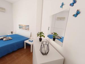 Posteľ alebo postele v izbe v ubytovaní Perla Home Speciale Vacanze 2025 Casa perfetta per gruppi coppie e famiglie vivi la Sicilia a modo tuo
