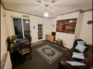 a living room with a couch and a table at Plymouth Airbnb in Plymouth