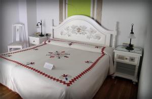 Postel nebo postele na pokoji v ubytování Hotel Doña Teresa
