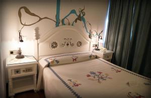 Postel nebo postele na pokoji v ubytování Hotel Doña Teresa