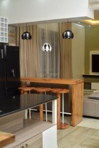 a kitchen with a table with a soccer ball on the wall at Isabirye residence in Kampala
