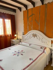 Postel nebo postele na pokoji v ubytování Hotel Doña Teresa
