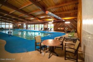 a large swimming pool with a table and chairs at Stoneridge Resort in Blanchard