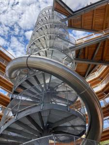 a metal spiral staircase in a building with the sky at Location, Location, Location-Immaculate 1 Bedroom Suite in Victoria