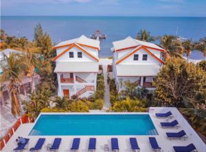 an aerial view of a resort with a swimming pool at VeLento Oceanfront #4 in Caye Caulker