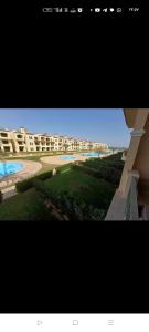 a picture of a view of a beach and buildings at Lasirina palm beach for families only in Ain Sokhna +33 photos