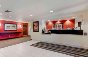 a lobby of a waiting room with a welcome counter at Extended Stay America Suites - San Jose - Santa Clara in San Jose
