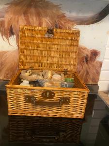 a wicker basket sitting on top of a table at Private en-suite RUTHIN in Llanfair-Dyffryn-Clwyd