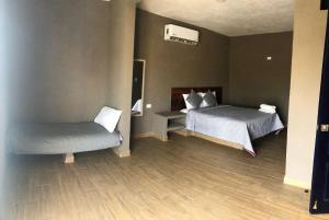 Postel nebo postele na pokoji v ubytování Casa Maravatío M R