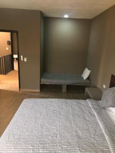 Postel nebo postele na pokoji v ubytování Casa Maravatío M R