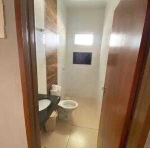 a bathroom with a sink and a toilet at Casa de temporada in Trindade +7 photos