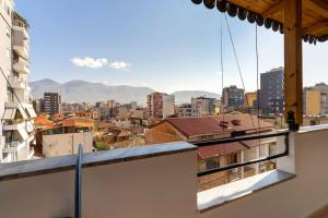 a view of a city from a balcony at NEW BAZAAR Apartment in Tirana