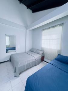Een bed of bedden in een kamer bij Morelove Hideaway in Grande Riviere