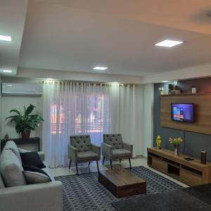 Uma TV ou centro de entretenimento em Espectacular Departamento - Excelente Ubicación mais 15 fotos