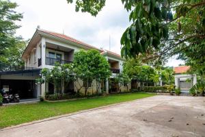 a house with a driveway in front of it at Elegant Escape Residence in Siem Reap