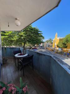 a balcony with a table and a view of a street at Departamento Santa Ana in Valladolid