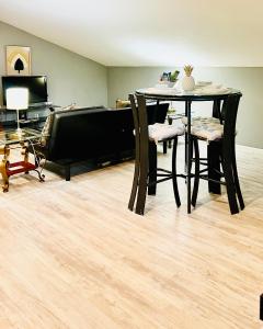 a dining room with a table and chairs at Loft Guest Suite 1 Bedroom in Charleston