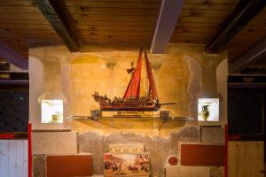 a model of a boat on the wall of a building at Guest House Roman Horizon in Split