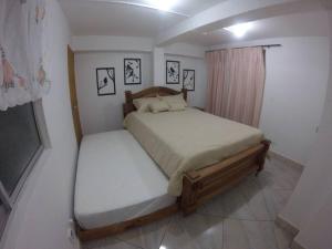 a bedroom with a large bed in a room at Right in the heart of Medellin in Medellín