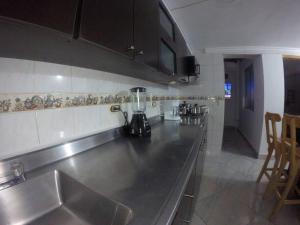 a kitchen with a stainless steel counter top at Right in the heart of Medellin in Medellín