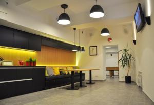 a living room with a couch and a table at Bomb Shelter apartment in Vilnius