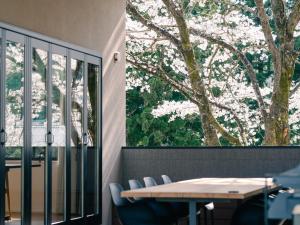 a table and chairs in front of a window at TEF TANIGUMI - Vacation STAY 78766v 